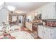 Functional kitchen with white cabinets, granite counters, and stainless steel appliances at 3152 H D Atha Rd, Covington, GA 30014