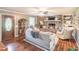 Inviting living room with stone fireplace, hardwood floors, and comfortable seating at 3152 H D Atha Rd, Covington, GA 30014