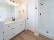 This bathroom features a double vanity, shower, toilet, and modern fixtures at 5916 Farmbrook Ln, Rex, GA 30273