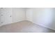 This bedroom features neutral carpet, white trim, and a closet for a clean and modern look at 5916 Farmbrook Ln, Rex, GA 30273
