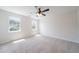 Bedroom features a ceiling fan, two windows, and carpeted flooring at 5916 Farmbrook Ln, Rex, GA 30273
