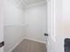View of walk-in closet space featuring wire shelving and neutral carpet at 5916 Farmbrook Ln, Rex, GA 30273