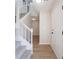 Bright foyer featuring a staircase, wood floors, and neutral paint creating a warm entry at 5916 Farmbrook Ln, Rex, GA 30273