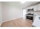 Bright eat-in kitchen featuring stainless steel appliances and modern white cabinets at 5916 Farmbrook Ln, Rex, GA 30273