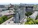 This aerial view displays a modern condo building and downtown skyline offering a blend of city living and nearby conveniences at 788 W Marietta Nw St # 308, Atlanta, GA 30318