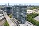 An aerial view of the condominium building captures the bustling city skyline and the convenient nearby transportation options at 788 W Marietta Nw St # 308, Atlanta, GA 30318