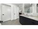 Modern bathroom has a large vanity, illuminated mirror and leads into the large walk-in closet at 788 W Marietta Nw St # 308, Atlanta, GA 30318