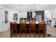 Kitchen with seating at the island, wine rack, and views to the living space and bedroom at 788 W Marietta Nw St # 308, Atlanta, GA 30318