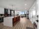Bright kitchen with open layout, large island, and adjacent living space with access to the deck at 788 W Marietta Nw St # 308, Atlanta, GA 30318