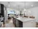 Open concept kitchen with seating at the island, stainless appliances, and eat-in area at 788 W Marietta Nw St # 308, Atlanta, GA 30318
