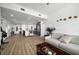 Bright and airy living room with hardwood floors flows into a modern kitchen with stainless steel appliances at 788 W Marietta Nw St # 308, Atlanta, GA 30318