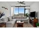 Comfortable living room featuring a large sectional sofa, neutral tones, and a view at 788 W Marietta Nw St # 308, Atlanta, GA 30318