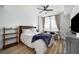 Bright main bedroom with natural light, a ceiling fan, and a seating area by the window at 788 W Marietta Nw St # 308, Atlanta, GA 30318