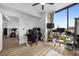 Bright home office with multiple workstations, hardwood floors, and expansive windows offering city views at 788 W Marietta Nw St # 308, Atlanta, GA 30318
