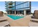 Enjoy the community pool with wading area, lounge chairs and views of the city and stylish building at 788 W Marietta Nw St # 308, Atlanta, GA 30318