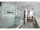 Luxurious shower with glass enclosure, tile walls, and open access to bedroom at 788 W Marietta Nw St # 308, Atlanta, GA 30318