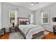 Comfortable bedroom featuring natural light, a ceiling fan and hardwood floors at 872 Briarcliff Ne Rd # B2, Atlanta, GA 30306