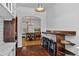 Open dining room with hardwood floors, modern lighting, and bar seating at 872 Briarcliff Ne Rd # B2, Atlanta, GA 30306