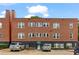 Apartment building exterior featuring brick facade and parking area at 872 Briarcliff Ne Rd # B2, Atlanta, GA 30306