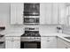 Updated kitchen featuring white cabinets, stainless steel appliances, and marble countertops at 872 Briarcliff Ne Rd # B2, Atlanta, GA 30306