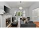 Bright living room featuring a fireplace, hardwood floors and access to the sunroom at 872 Briarcliff Ne Rd # B2, Atlanta, GA 30306