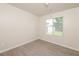 Bright bedroom featuring wood-look vinyl flooring and a window with blinds at 113 Garden Walk, Stockbridge, GA 30281
