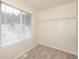 Walk-in closet featuring wire shelving and a window with blinds at 113 Garden Walk, Stockbridge, GA 30281