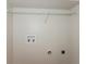 Utility room with washer and dryer hookups and a wire shelf for storage at 113 Garden Walk, Stockbridge, GA 30281