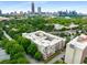 Aerial view showcases the building's prime location surrounded by lush greenery and cityscape at 384 Ralph Mcgill Ne Blvd # 123, Atlanta, GA 30312
