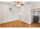 Bright bedroom featuring hardwood floors, a ceiling fan, closet and ensuite bathroom access at 384 Ralph Mcgill Ne Blvd # 123, Atlanta, GA 30312