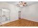Spacious bedroom with hardwood floors and access to the private en-suite bathroom at 384 Ralph Mcgill Ne Blvd # 123, Atlanta, GA 30312