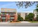 A modern condominium building with balconies, complemented by well-maintained landscaping and nearby parking at 384 Ralph Mcgill Ne Blvd # 123, Atlanta, GA 30312