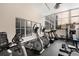 A well-equipped condo gym featuring treadmills, ellipticals, and weights, bathed in natural light from large windows at 384 Ralph Mcgill Ne Blvd # 123, Atlanta, GA 30312