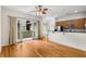 Bright living room features hardwood floors, ceiling fan, and access to the balcony at 384 Ralph Mcgill Ne Blvd # 123, Atlanta, GA 30312