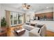 Cozy living room with a sectional sofa, modern lighting, and a balcony at 384 Ralph Mcgill Ne Blvd # 123, Atlanta, GA 30312