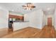 Open concept living room with hardwood floors and kitchen with stainless appliances at 384 Ralph Mcgill Ne Blvd # 123, Atlanta, GA 30312