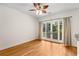 Bright living room with gleaming hardwood floors and glass doors to the balcony at 384 Ralph Mcgill Ne Blvd # 123, Atlanta, GA 30312