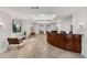 An elegant condo lobby with travertine flooring, featuring a reception desk, seating, and elevator access at 384 Ralph Mcgill Ne Blvd # 123, Atlanta, GA 30312