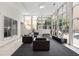 Bright lounge with floor to ceiling windows, stylish furniture, and contemporary design at 384 Ralph Mcgill Ne Blvd # 123, Atlanta, GA 30312