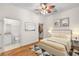 A staged main bedroom with hardwood floors, attached bathroom, and walk in closet at 384 Ralph Mcgill Ne Blvd # 123, Atlanta, GA 30312