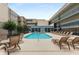 A serene condo pool area with lounge chairs and tables, providing a relaxing retreat for residents at 384 Ralph Mcgill Ne Blvd # 123, Atlanta, GA 30312