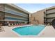 Inviting condo pool with lounge chairs and manicured landscaping, offering a tranquil space for relaxation and leisure at 384 Ralph Mcgill Ne Blvd # 123, Atlanta, GA 30312
