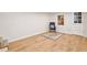 Spacious basement featuring modern flooring, a stylish chair, and a decorative area rug at 3852 Vinyard Ne Ct, Marietta, GA 30062