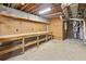Spacious unfinished basement with block walls and wooden work benches at 3852 Vinyard Ne Ct, Marietta, GA 30062