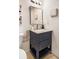 Bathroom featuring a stylish vanity, elegant mirror, and modern fixtures at 3852 Vinyard Ne Ct, Marietta, GA 30062