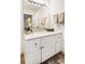 Bathroom with white vanity, large mirror, and decorative accents at 3852 Vinyard Ne Ct, Marietta, GA 30062