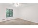 Bright bedroom with neutral carpet and large window overlooking trees at 3852 Vinyard Ne Ct, Marietta, GA 30062