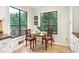 Cozy breakfast nook with wood chairs and lots of natural light at 3852 Vinyard Ne Ct, Marietta, GA 30062