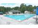 Inviting community pool area with lounge chairs and shaded pavilion for relaxing poolside at 3852 Vinyard Ne Ct, Marietta, GA 30062
