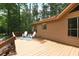 Back deck featuring chairs and a rug, as well as siding on the home at 3852 Vinyard Ne Ct, Marietta, GA 30062